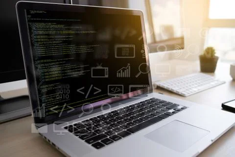 Man work Coding software developer programmer is coding on a desktop computer 写真素材