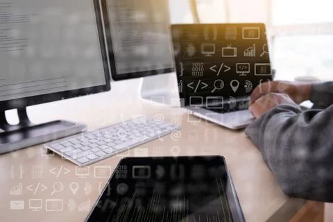 Man work Coding software developer programmer is coding on a desktop computer 库存照片