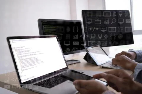 Man work Coding software developer programmer is coding on a desktop computer Foto stock