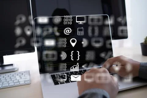 Man work Coding software developer programmer is coding on a desktop computer Stock Photos