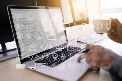 Man work Coding software developer programmer is coding on a desktop computer Foto stock