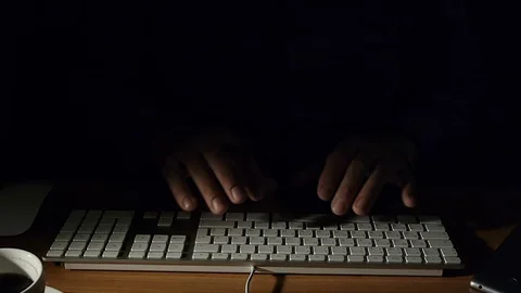 Man at work at the computer enters text using the keyboard Stock Footage 71451952
