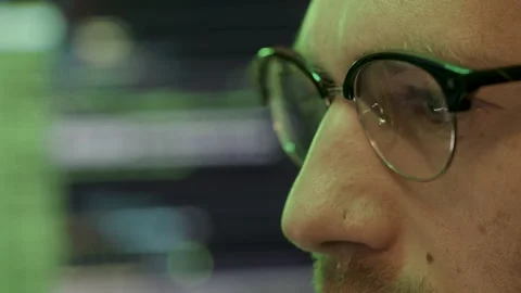 A man at work (computer programmer, hacker, employee), surrounded by 動画素材 236674540