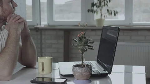 Man at work desk with laptop. Bored, sad worker, tired person, unmotivated man Stock Footage 142244943