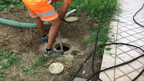 Man at work during a septic tank cleaning of a kitchen 02 Stock Footage 91752150