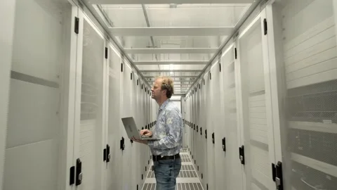 Man at work inside a Dutch Datacenter corridor Stock Footage 294988113