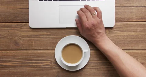 Man work on laptop and drink coffee with milk Stock Footage 134048134