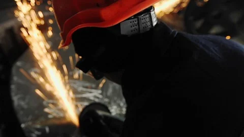 Man work with Metal processing factory. Sparks. Stock Footage 105563465