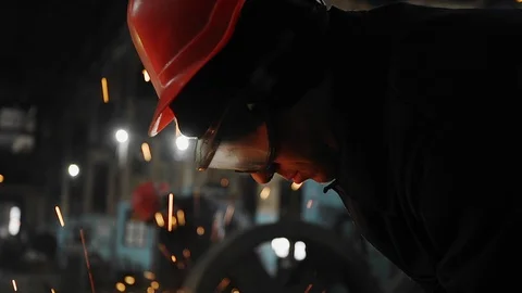 Man work with Metal processing factory. Sparks. Stock Footage 105563873