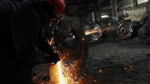 Man work with Metal processing factory. Sparks. Stock Footage 105565365