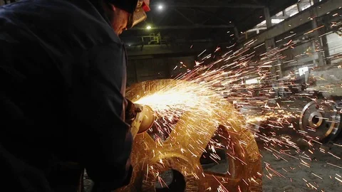 Man work with Metal processing factory. Sparks. Stock Footage 105565575