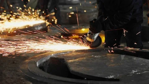 Man work with Metal processing factory. Sparks. Stock Footage 105565947
