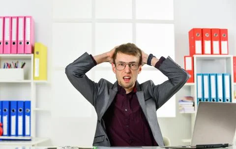 Man work online laptop computer in office, failure and mistake concept Stock Photos