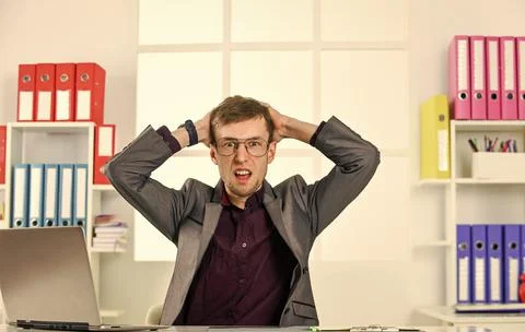Man work online laptop computer in office, failure and mistake concept Stock Photos