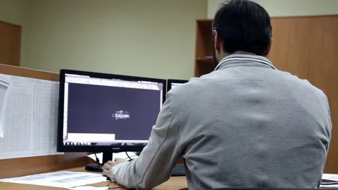 Man work on PC in Stock Footage 77436891