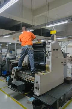 Man work in printery Stock Photos