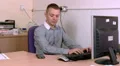 Man at work receives a happy phone call HD Footage