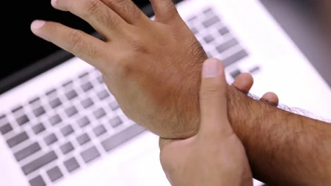Man work so hard and long time that he has office syndrome. He has wrist pain, f Stock Footage 151672743