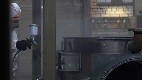 Man work with spray gun, applying black composition, anti-corrosion composition Stock Footage 120062876