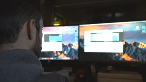 Man at Work with Two Computers Video stock 86517509