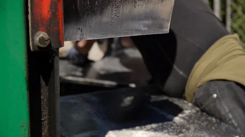 Man work with Wood Chopping Machine. Saw cutting wood. Stock Footage 105957642