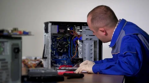 Man worker in blue jacket check computer maintenance. 4K Video stock 129724325