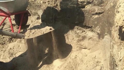 Man worker digs a hole in the ground with a shovel and puts it in a cart. grave Stock-Footage 132225023