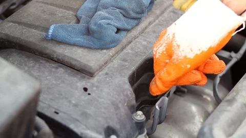 Man worker with glove checking car engine oil. Car engine control repair Stock-Footage 111050324
