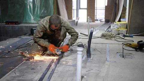 The man - worker grinds indoor Stock Footage 150481741