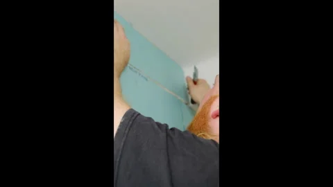 Man worker with hearing aid knocks with fist on panel Stock Footage 304408387