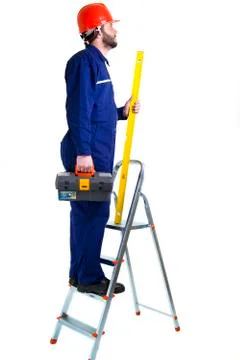 Man worker on the ladder Stock-Fotos