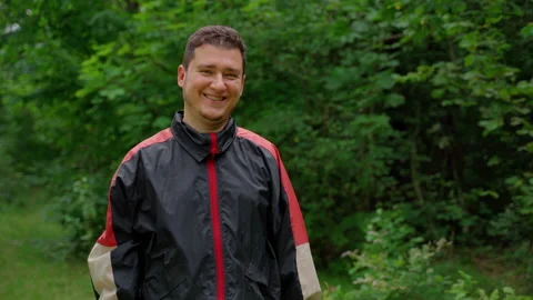 Man worker stand in forest looking at camera, smile Stock Footage 158144252
