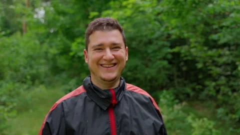 Man worker stand in forest looking at camera, smile Stock Footage 158145323
