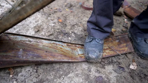 Man worker takes apart old material with hammer Stock Footage 158979000