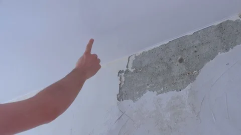 Man worker touching suspended ceiling in room making renovation, closeup hand. Video stock 123345849