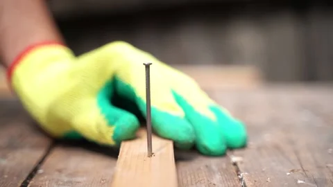 Man worker using hammer to nail wood plank Stock Footage 133241738