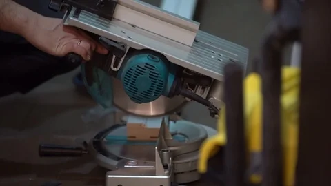 Man (worker/Builder) sawing with a circular saw 스톡 동영상 104027922