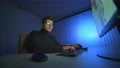 The man working with a 3d manipulator and a computer at the table. night time 4k or 4k+ Resolution