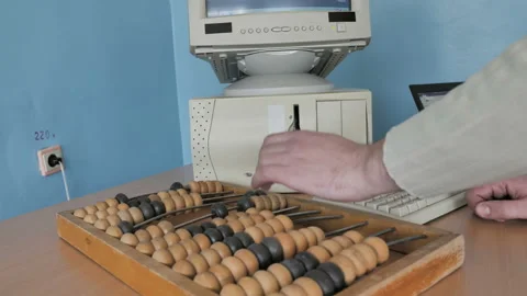 Man Working With Abacus An Ancient Calculator, Retro Computer And Modern Laptop. Stock Footage 126372756