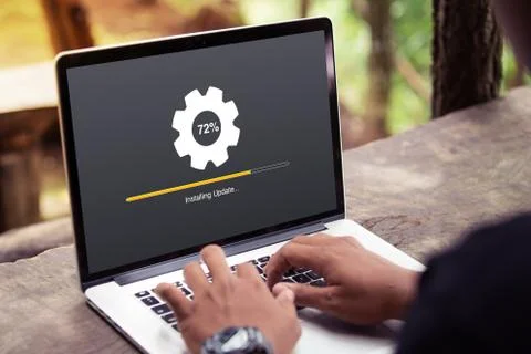 Man working and Installing update process with gearbox percentage progress  Stock Photos