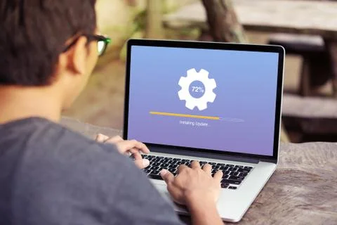 Man working and Installing update process with gearbox percentage progress Stock Photos