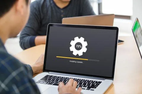 Man working and Installing update process with gearbox percentage progress Stock Photos