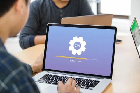 Man working and Installing update process with gearbox percentage progress Stock Photos