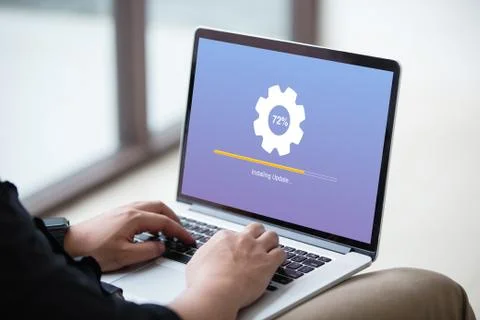 Man working and Installing update process with gearbox percentage progress Stock Photos