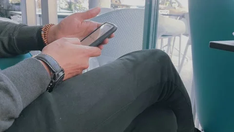 Man working and using with his mobile phone in a coffee shop Stock Footage 201218326