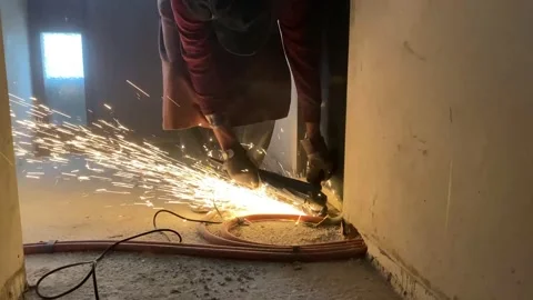 Man working with angle grinder Stock Footage 146179131