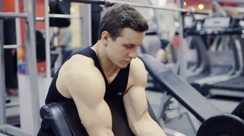 Man working arms  gym, lifting bells, slow motion Stock Footage 58506217