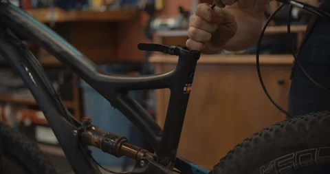 Man Working On Bike 스톡 동영상 105872122