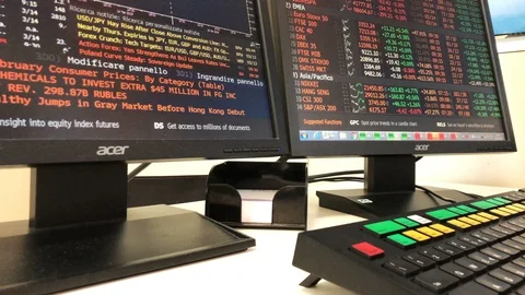 Man is working on a Bloomberg terminal Stock Footage 104715769