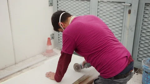 Man working in a building site with the mask for covid Stock Footage 129954543